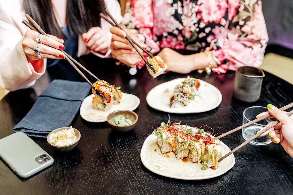 friends sharing wings at restaurant table